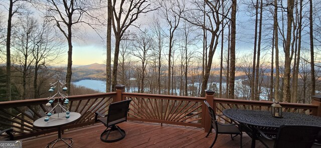 1289 Rainwater Trl, Tiger, GA 30576 - deck at dusk with outdoor dining space