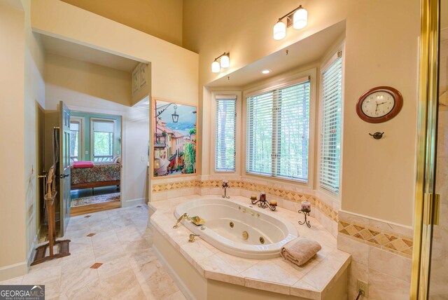 1289 Rainwater Trl, Tiger, GA 30576 - bathroom featuring a whirlpool tub and connected bathroom