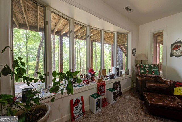 1289 Rainwater Trl, Tiger, GA 30576 - sunroom featuring healthy amount of natural light, carpet floors, and baseboards