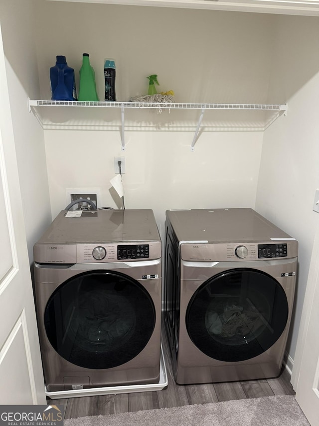 536 Magnolia Cir Unit 116, Palmetto, GA 30268 - laundry room featuring washer and dryer and wood finished floors