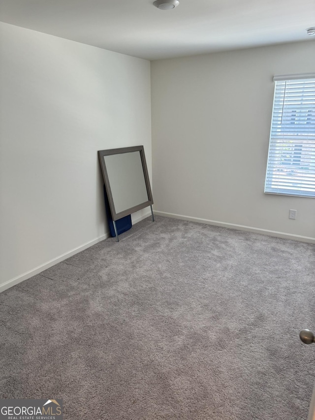 536 Magnolia Cir Unit 116, Palmetto, GA 30268 - carpeted spare room featuring baseboards