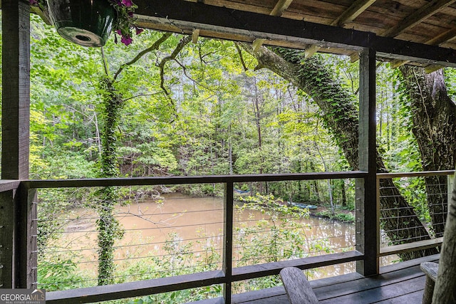 74 Charity Ln, Clayton, GA 30525 - wooden terrace with a view of trees