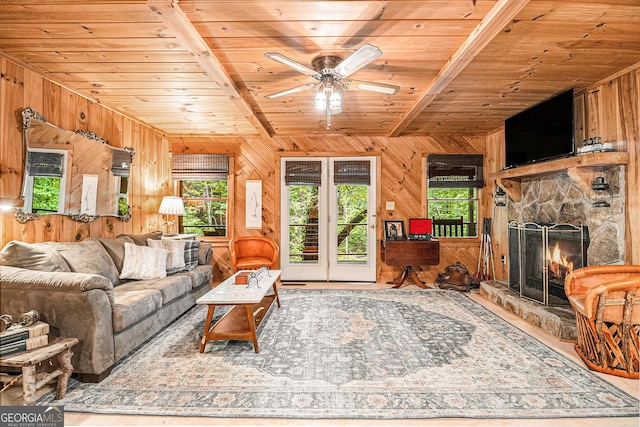 74 Charity Ln, Clayton, GA 30525 - living area featuring wood ceiling, wood walls, plenty of natural light, a fireplace, and a ceiling fan