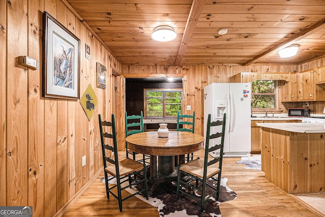 74 Charity Ln, Clayton, GA 30525 - dining room with wooden ceiling, light wood-style floors, wood walls, and baseboards
