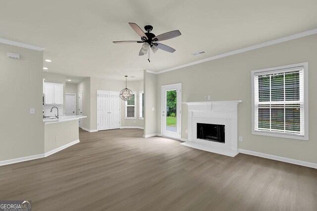 6341 Stewart Ridge Walk, Buford, GA 30518 - unfurnished living room featuring a sink, ornamental molding, dark wood-style floors, baseboards, and recessed lighting
