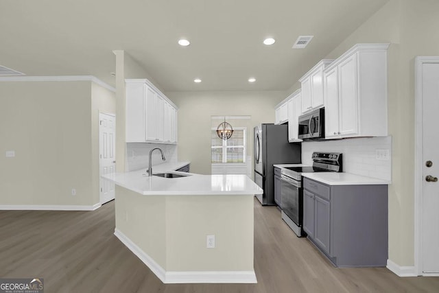 6341 Stewart Ridge Walk, Buford, GA 30518 - kitchen featuring stainless steel appliances, a sink, light wood-type flooring, backsplash, and recessed lighting