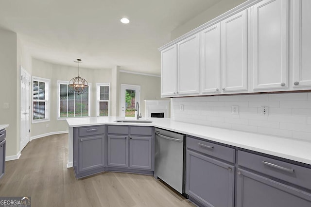 6341 Stewart Ridge Walk, Buford, GA 30518 - kitchen with dishwasher, a sink, gray cabinets, light countertops, and backsplash