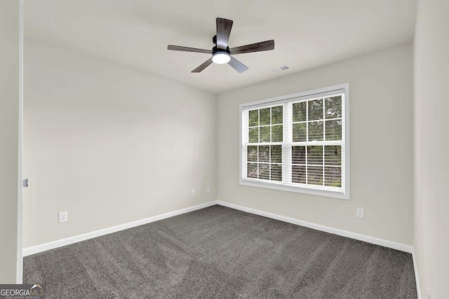 6341 Stewart Ridge Walk, Buford, GA 30518 - spare room featuring baseboards, ceiling fan, and dark carpet