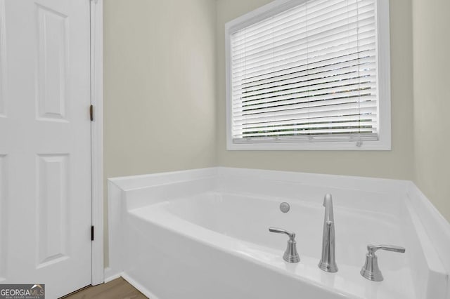 6341 Stewart Ridge Walk, Buford, GA 30518 - bathroom with a garden tub