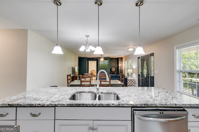 103 Depot St, Buchanan, GA 30113 - kitchen with dishwasher, a sink, a chandelier, light stone counters, and white cabinetry