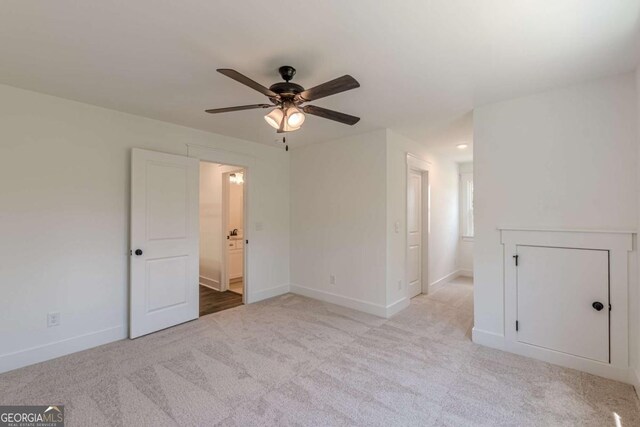 4075 O Henry Ct, Mcdonough, GA 30252 - spare room with a ceiling fan, light colored carpet, and attic access