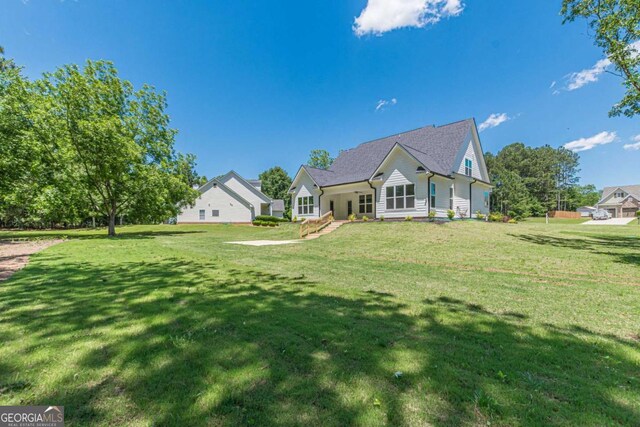 4075 O Henry Ct, Mcdonough, GA 30252 - rear view of house featuring a lawn