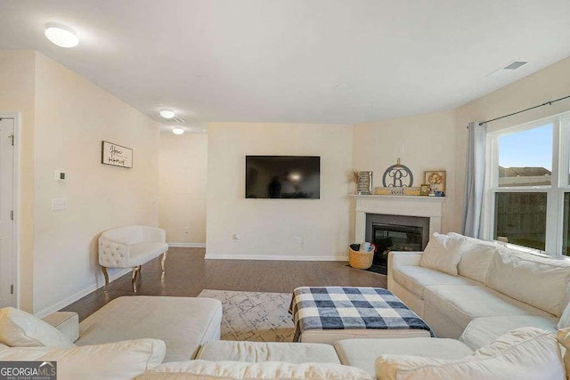 105 Paulowina Cir, Mcdonough, GA 30253 - living room with baseboards, wood finished floors, and a glass covered fireplace