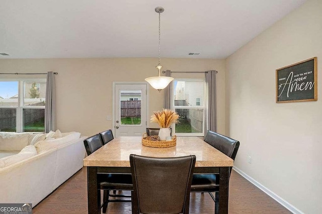 105 Paulowina Cir, Mcdonough, GA 30253 - dining area featuring plenty of natural light, dark wood-style flooring, and baseboards