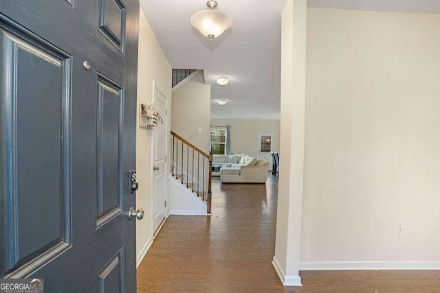 105 Paulowina Cir, Mcdonough, GA 30253 - foyer entrance with dark wood-style flooring, baseboards, and stairway