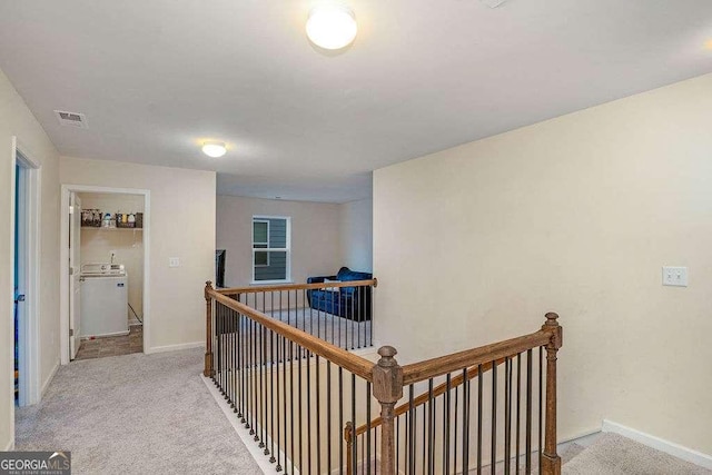 105 Paulowina Cir, Mcdonough, GA 30253 - hallway featuring an upstairs landing, washer / clothes dryer, carpet floors, and baseboards