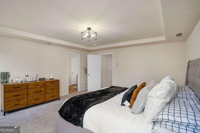 105 Paulowina Cir, Mcdonough, GA 30253 - bedroom with a tray ceiling, light colored carpet, a chandelier, and baseboards