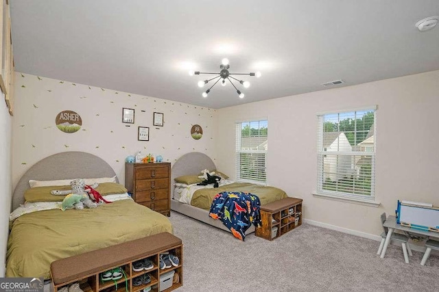 105 Paulowina Cir, Mcdonough, GA 30253 - carpeted bedroom featuring a chandelier and baseboards