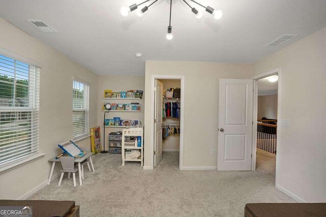 105 Paulowina Cir, Mcdonough, GA 30253 - carpeted bedroom featuring a spacious closet, baseboards, and a closet