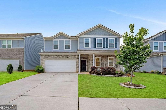 105 Paulowina Cir, Mcdonough, GA 30253 - view of front of property with driveway, brick siding, a front yard, and a garage