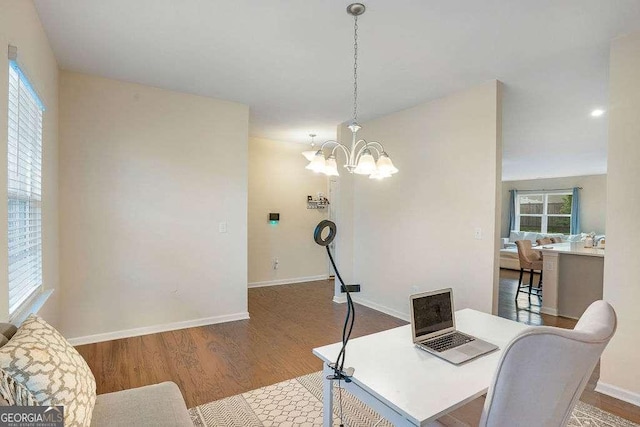 105 Paulowina Cir, Mcdonough, GA 30253 - dining area with wood finished floors, healthy amount of natural light, baseboards, and a chandelier