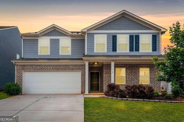 105 Paulowina Cir, Mcdonough, GA 30253 - view of front facade featuring concrete driveway, an attached garage, brick siding, and a front yard