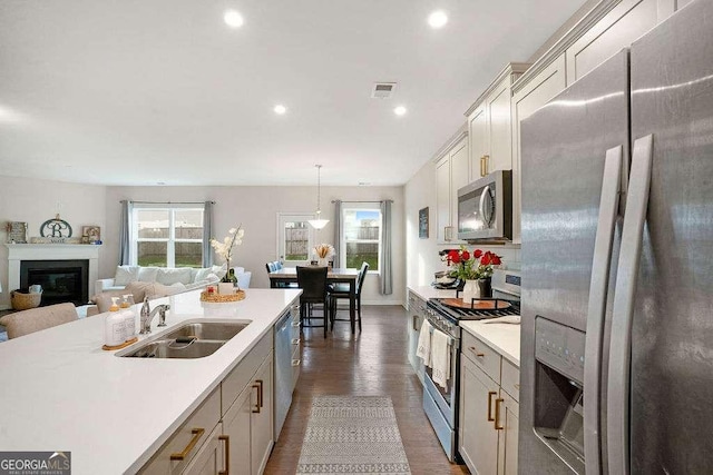 105 Paulowina Cir, Mcdonough, GA 30253 - kitchen with appliances with stainless steel finishes, a sink, healthy amount of natural light, light countertops, and recessed lighting