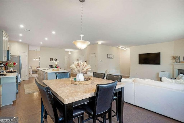 105 Paulowina Cir, Mcdonough, GA 30253 - dining room with dark wood finished floors and recessed lighting