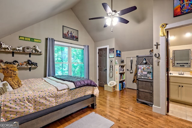 177 Whitetail Trl, Clayton, GA 30525 - bedroom with lofted ceiling, light wood-style floors, a sink, ensuite bathroom, and ceiling fan