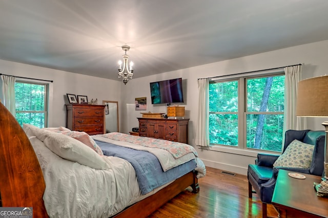 177 Whitetail Trl, Clayton, GA 30525 - bedroom featuring wood finished floors, a chandelier, and baseboards