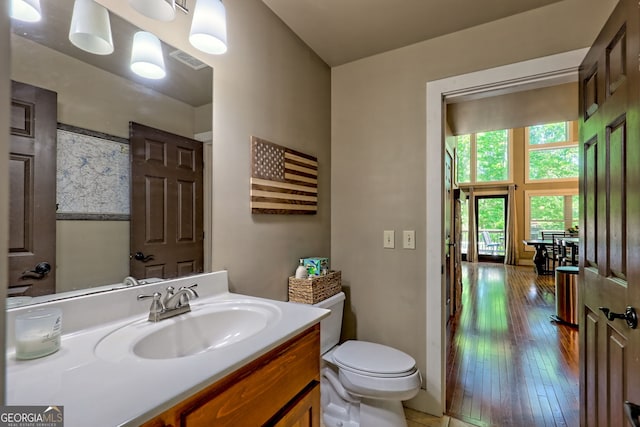 177 Whitetail Trl, Clayton, GA 30525 - bathroom with toilet, vanity, and wood-type flooring