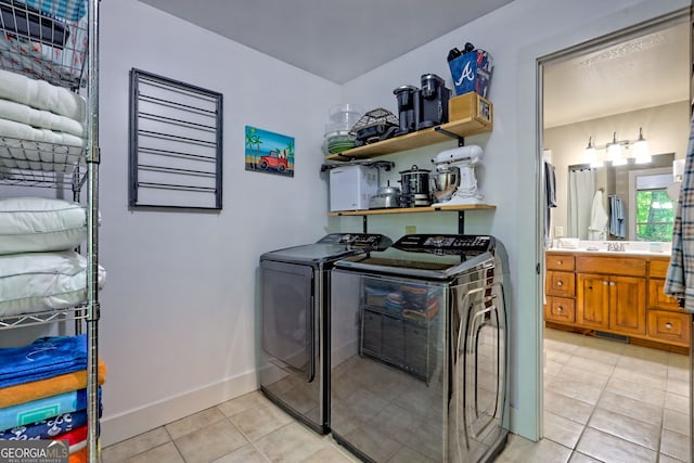 177 Whitetail Trl, Clayton, GA 30525 - laundry area featuring washer and clothes dryer, light tile patterned floors, and baseboards