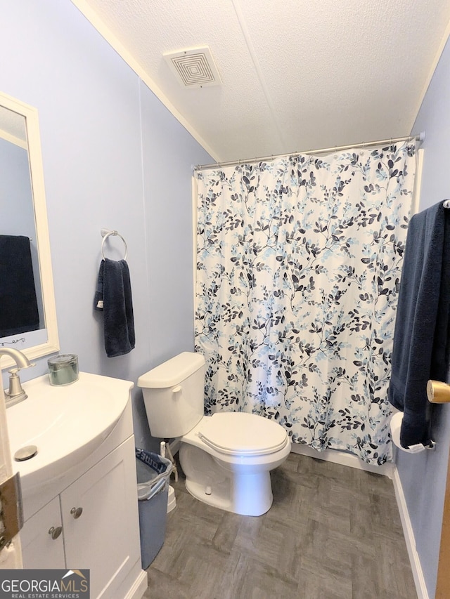 1096 Tesnatee Gap Valley Rd, Cleveland, GA 30528 - full bath with toilet, vanity, curtained shower, a textured ceiling, and baseboards
