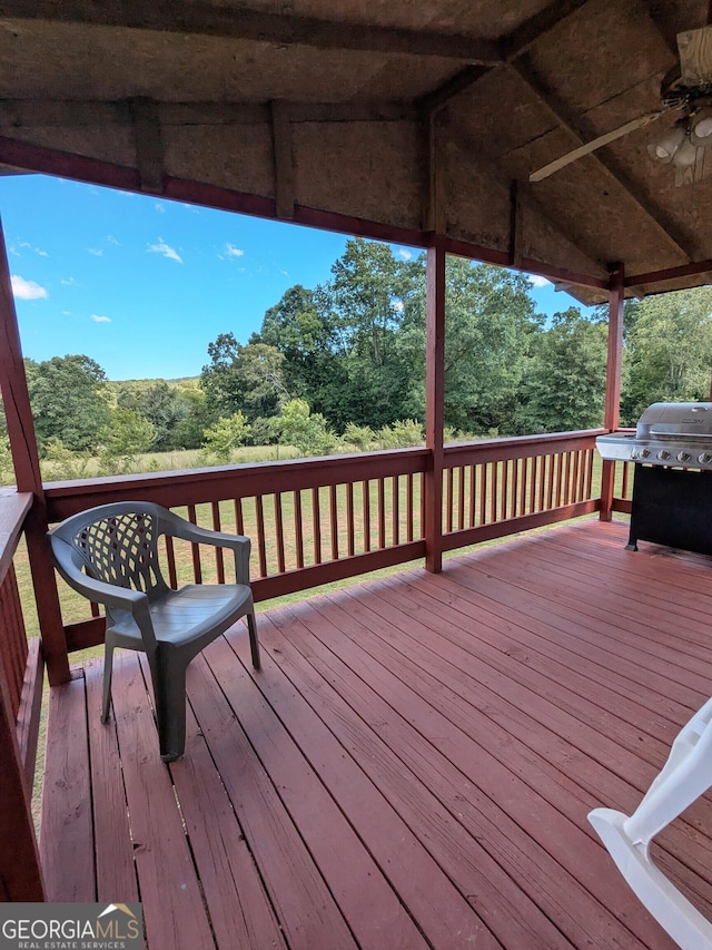 1096 Tesnatee Gap Valley Rd, Cleveland, GA 30528 - deck with a grill, ceiling fan, and view of scattered trees