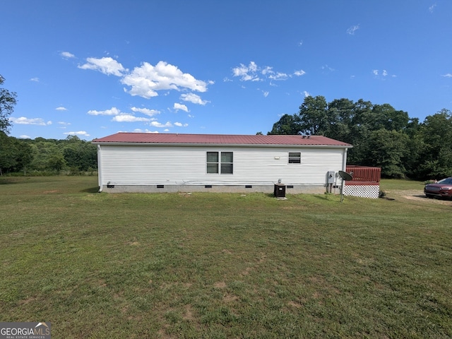 1096 Tesnatee Gap Valley Rd, Cleveland, GA 30528 - back of property with a lawn, crawl space, metal roof, and central air condition unit