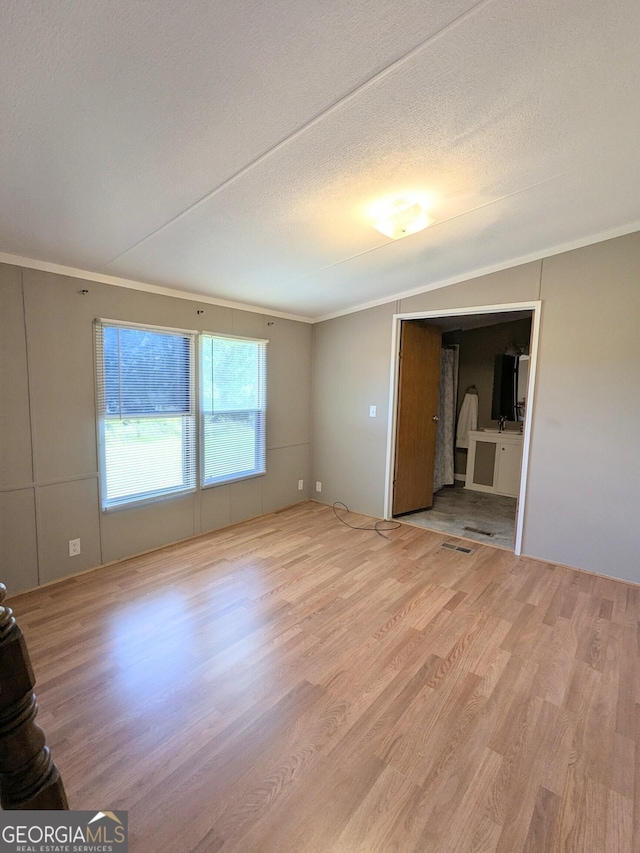 1096 Tesnatee Gap Valley Rd, Cleveland, GA 30528 - unfurnished living room with ornamental molding, wood finished floors, and a textured ceiling