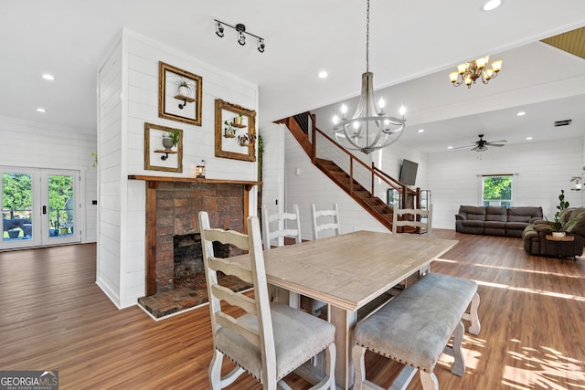 7170 Church St, Bartow, GA 30413 - dining room with a chandelier, wood finished floors, plenty of natural light, recessed lighting, and wood walls