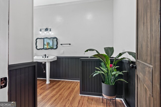 7170 Church St, Bartow, GA 30413 - bathroom featuring wood finished floors and wainscoting