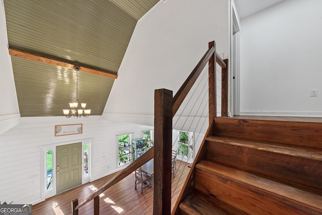 7170 Church St, Bartow, GA 30413 - entrance foyer with a chandelier, vaulted ceiling, stairs, and wood finished floors