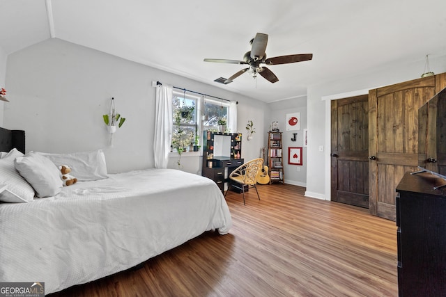 7170 Church St, Bartow, GA 30413 - bedroom featuring light wood-style flooring, baseboards, a ceiling fan, and vaulted ceiling