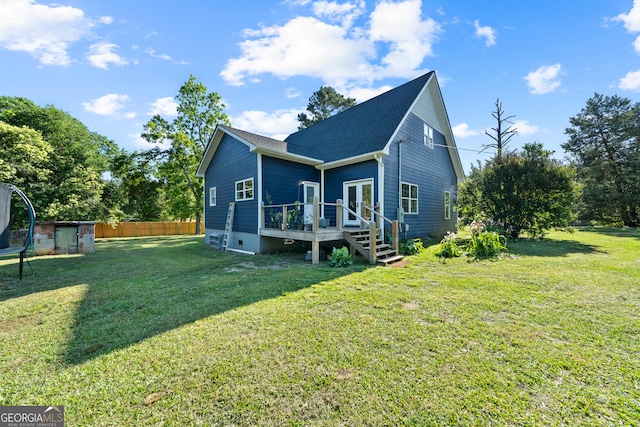 7170 Church St, Bartow, GA 30413 - rear view of house featuring a deck and roof with shingles