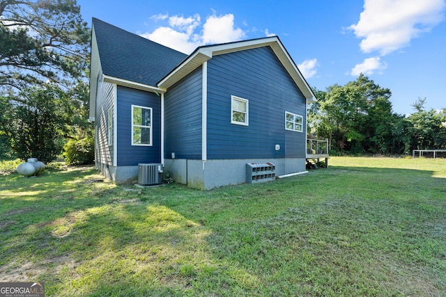 7170 Church St, Bartow, GA 30413 - view of property exterior featuring a yard, cooling unit, and a shingled roof