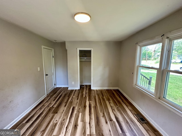 1681 Stanton Rd SW, Atlanta, GA 30311 - unfurnished bedroom with a closet, wood finished floors, and baseboards