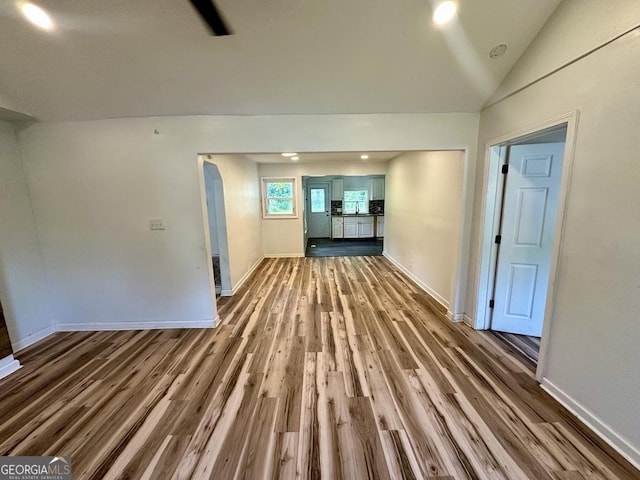 1681 Stanton Rd SW, Atlanta, GA 30311 - unfurnished living room with wood finished floors, baseboards, and lofted ceiling