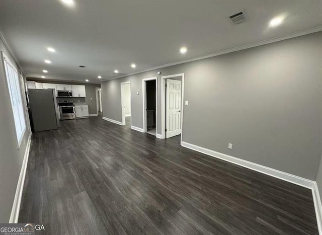 5711 Sterling Pl, Macon, GA 31206 - unfurnished living room with baseboards, recessed lighting, crown molding, and dark wood finished floors