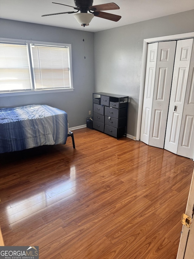 206 Audubon Way, Warner Robins, GA 31088 - bedroom featuring wood finished floors, baseboards, a ceiling fan, and a closet