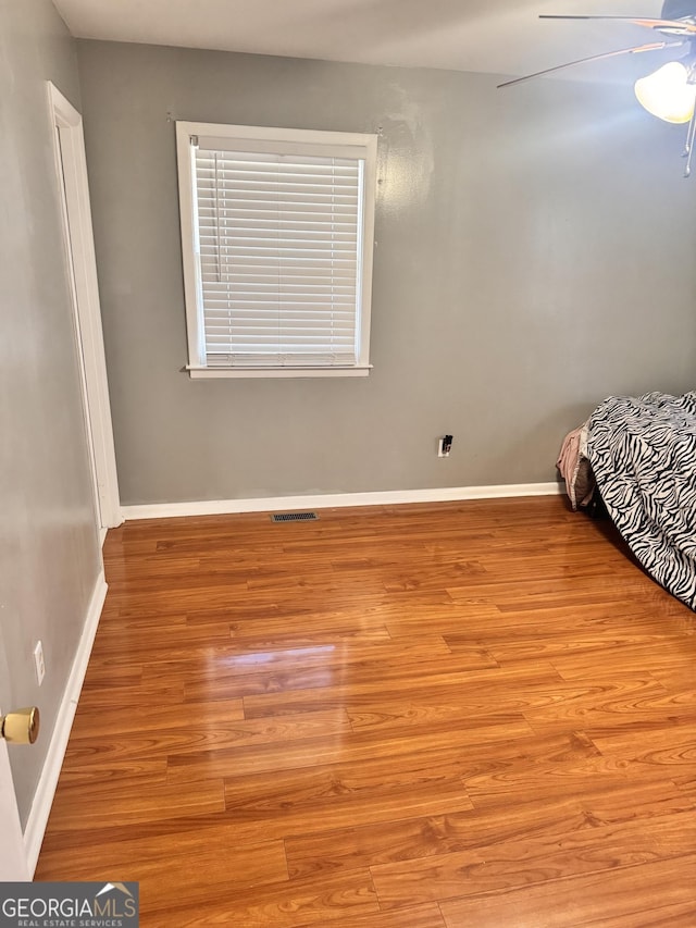 206 Audubon Way, Warner Robins, GA 31088 - bedroom with light wood-type flooring, baseboards, and ceiling fan