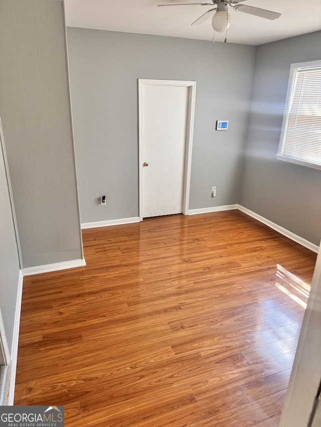 206 Audubon Way, Warner Robins, GA 31088 - empty room featuring ceiling fan, light wood-style floors, and baseboards