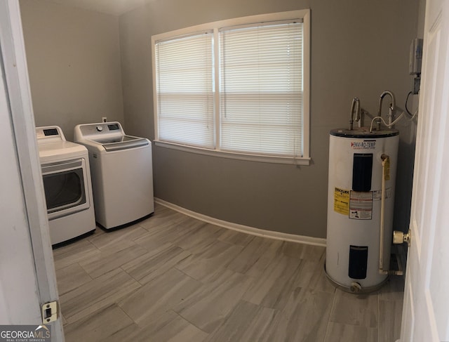 206 Audubon Way, Warner Robins, GA 31088 - laundry room featuring electric water heater, washer and clothes dryer, and baseboards