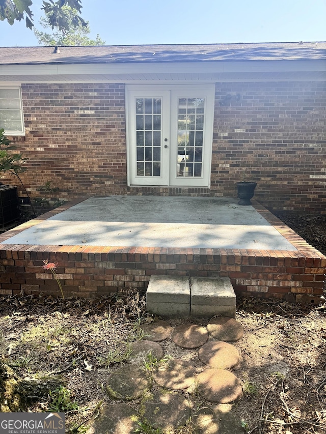 206 Audubon Way, Warner Robins, GA 31088 - view of patio featuring french doors and central AC unit
